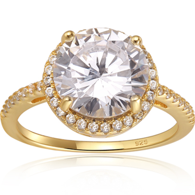 Features a 3-carat round cut center stone
Surrounded by a gorgeous halo set in a prong setting
Set with a pave band, this ring features 45 total stones
Sterling silver with 14K gold plating
Available in silver and sizes 4 through 11