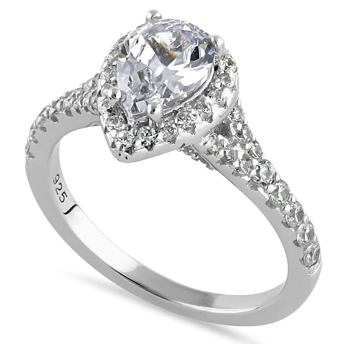 Express yourself with extra dazzle - this pear-shaped ring boasts 63 stones!
Features a 1-carat pear shaped center stone surrounded by a sparkling halo of round stones
Delicate round stones cascade down each side of the band
A total of 63 triple A CZ stones
Band is crafted of rhodium plated sterling silver
Available in sizes 5 through 11