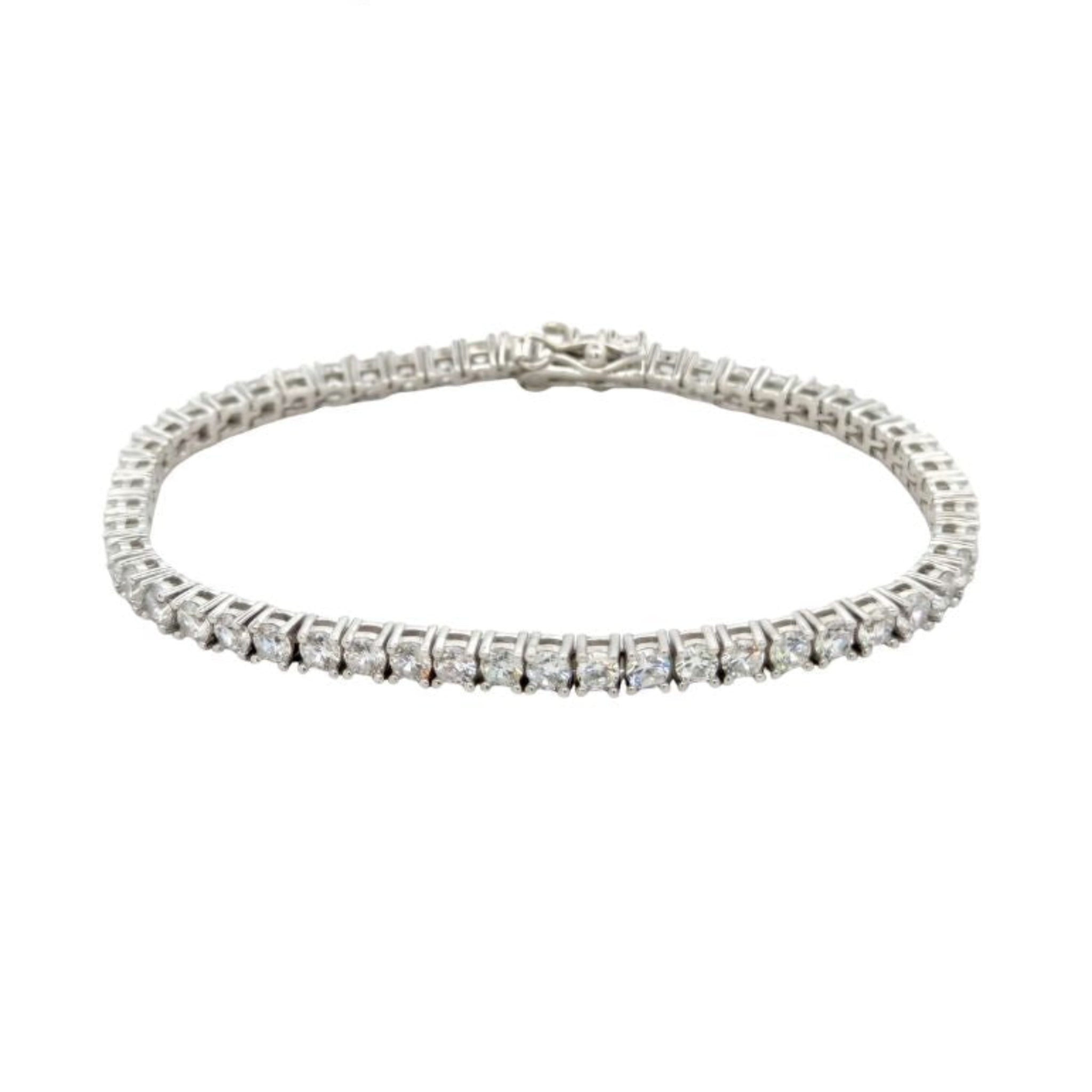 Silver tennis bracelet with clear stones on a white background, branded 'Starlette'.