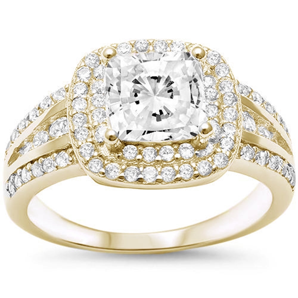 Features a dazzling 2 Carat princess cut ring
Intricate double halo of pavé stones down the band
Sterling silver with 14K gold plating
Available in sizes 4 through 11
Also available in silver