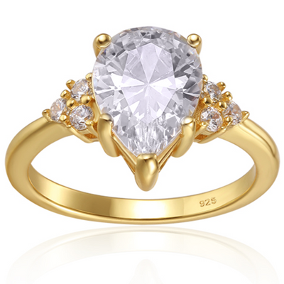 Features a 2-carat (11mm x 8mm) pear shape center stone
Surrounded by 3 round cut stones on each side of the center stone
Set in a stunning prong setting
Available in sizes 4 through 11