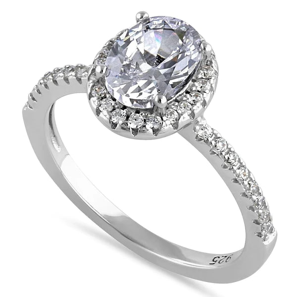 Features a 1.2-carat oval cut center stone
Surrounded by small round stones in a delicate halo
Smaller round stones down each side of the band for a total of 40 stones