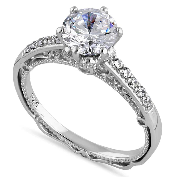 Features a 1.2-carat round center stone surrounded by delicate round stones lining the intricate band.
Set in a prong setting, the band measures 2.1mm and features 47 total stones
925 Sterling Silver plated in Rhodium
Available in sizes 5 through 10