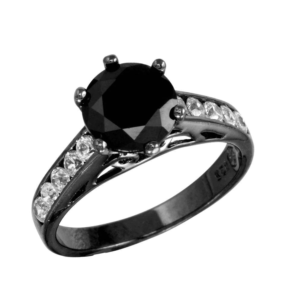 Black rhodium plated
Features a bold 1.5 carat black CZ center stone, plus five smaller clear CZ stones sparkling down the band
Available in sizes 5 through 9