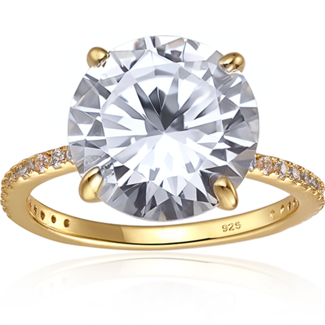 Features 4.5 carat round cut center stone, surrounded by stones embedded in the band
Covering approximately 3/4 of the 1.2 mm thick band, with the prong profile is 1 cm tall
Plated in 14K gold
Available in silver and in sizes 4 through 11
