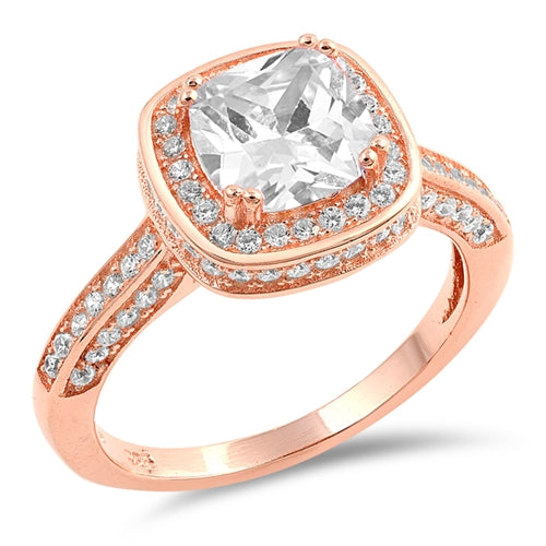 The Audrey will sparkle no matter where you are. This classic rose gold ring is sure to become your favorite.
Features a 1.5-carat cushion cut center stone
Surrounded by a beautiful halo of CZ stones.
Small CZ stones also line the face and sides of the band
The band measures 4mm wide and is crafted of sterling silver plated in rose gold
Available in sizes 5 through 11