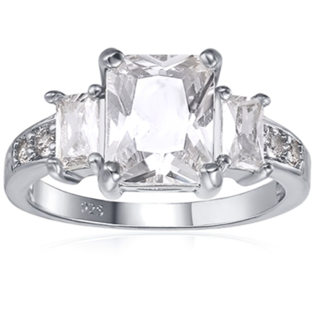 Features a 3-carat emerald center stone
Surrounded by two .5-carat emerald cut stones
Set in a gorgeous prong setting
The Gretchen ring has 7 total stones