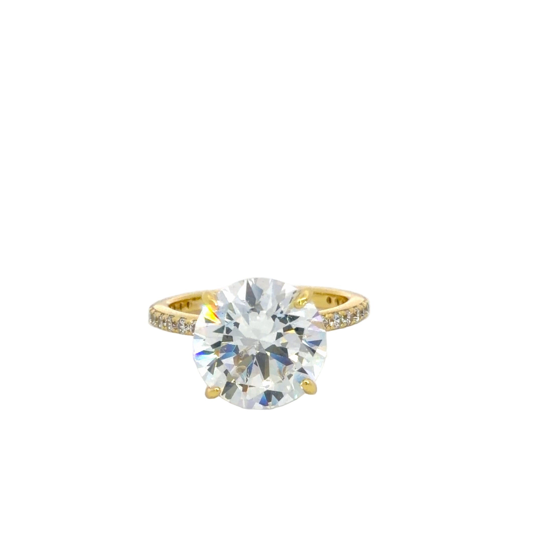 Gold ring with a large cubic zirconia stone on a white background