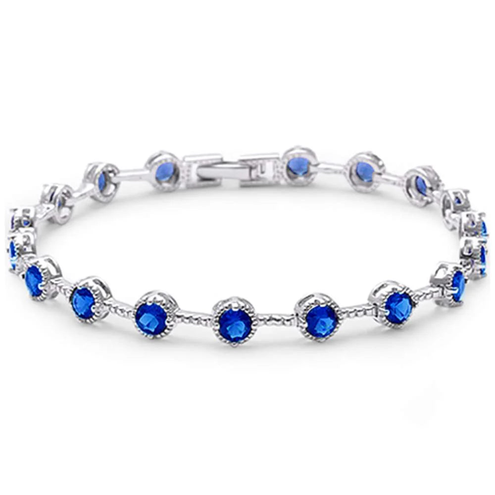 Get ready to get your sparkle on this Summer with the Sapphire Glow Tennis Bracelet!
This beauty features .20 carat round, sapphire blue stones
Surrounded by a silver beaded halo
Set on a .925 sterling silver band
At 7" long, it's the perfect fit for the Summer holidays!