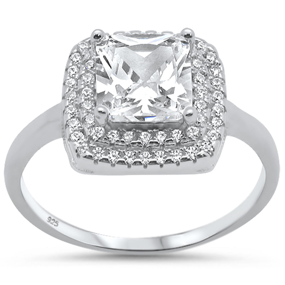 Features a 2-carat princess cut center stone
Surrounded by a double halo set in a gorgeous prong setting.
Sterling silver and features 57 total stones
