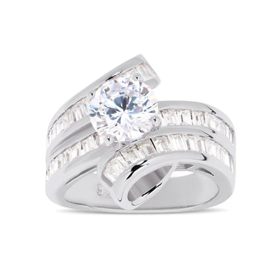 Features a 1.50-carat round center stone
Surrounded by a unique twisted channel emerald band set in a prong setting
Sterling silver and plated in Rhodium
Available in sizes 4 through 10