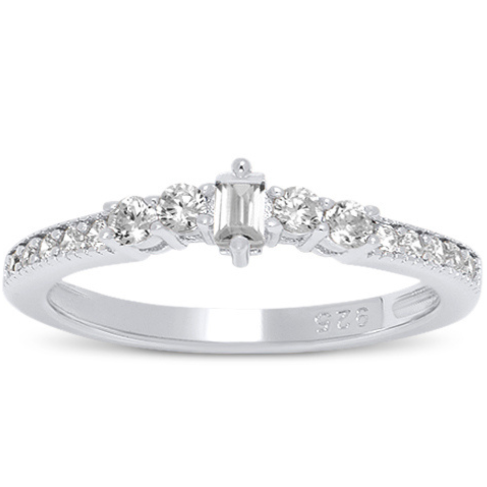 Features a timeless emerald-cut stone
2 round cut stones run down each side with a classic prong setting.
Trailing the slender band is more stones in a bead bright setting
Made of certified 925 sterling silver and plated in rhodium
The stones are made of 100% simulated diamond material (AAA CZ)