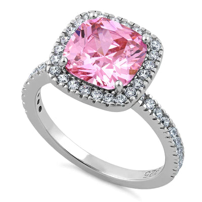 The Hannah Ring is ready for Spring and Summer vibes. May be worn with a sundress or even jeans and your favorite pink t-shirt!

Features a 2.75 carat pink cushion center stone framed in a raised halo setting
Sparkling small round cubic zirconia stones adorn both the halo and band
Available in sizes 6 through 12