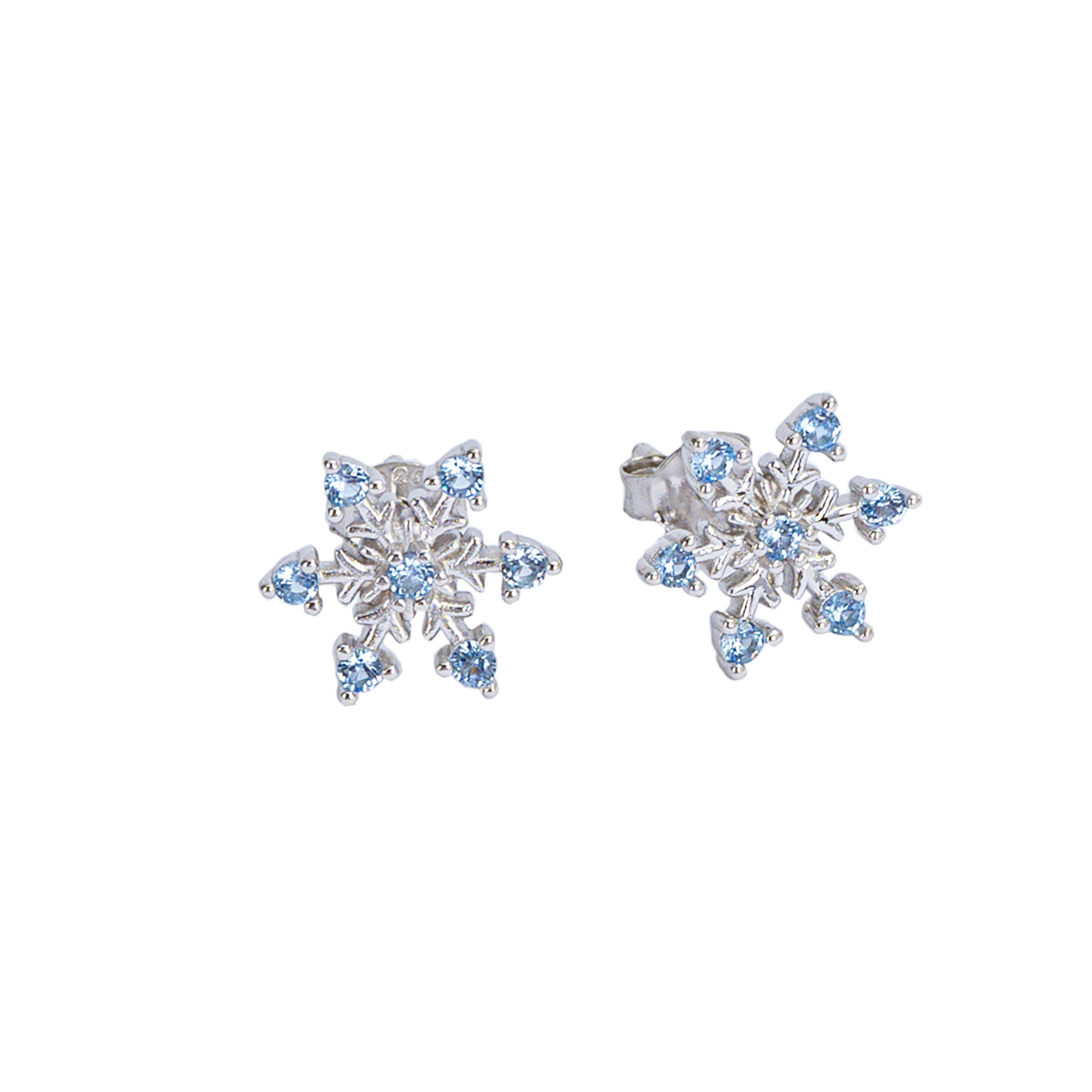 Snowflake-shaped earrings with blue gemstones on a white background