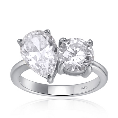 Features a 1-carat round cut stone (7mm x 7mm) and a 1.5-carat pear cut stone (10mm x 7mm) double center stone
Solitaire setting set in a beautiful prong setting
Sterling silver plated with Rhodium
Also available in gold
Ring sizes 4 through 11