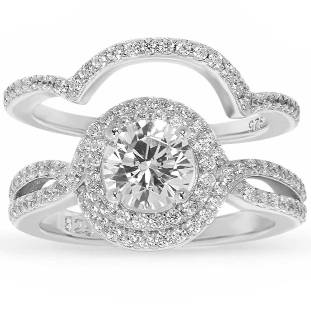 Features a 1-carat round cut center stone
Surrounded by an intricate double halo set in a stunning infinity band
Sterling silver and plated in Rhodium
Available in sizes 4 through 12