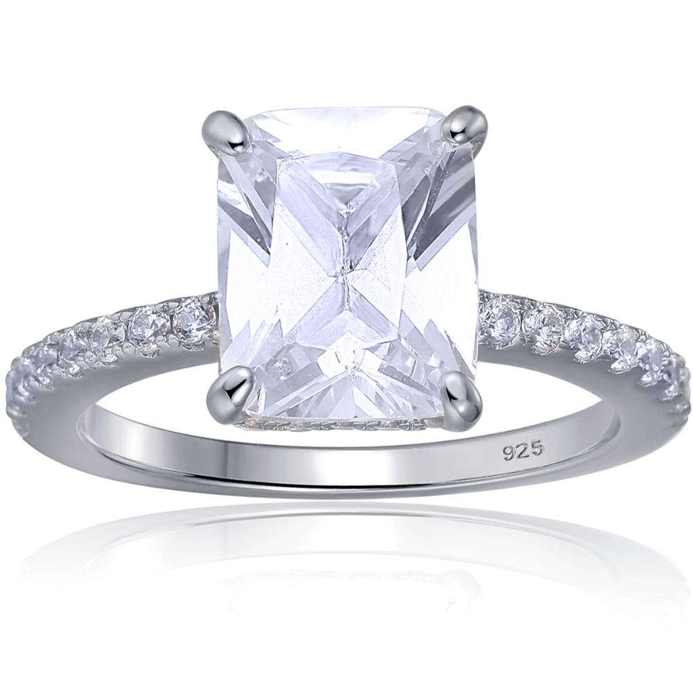 Features a 3-carat center emerald-cut stone with a hidden halo underneath the main stone
Triple A CZ stones in a sterling silver setting
14K gold plating
Set in a gorgeous 4 prong setting

Available in silver and in sizes 4 through 11