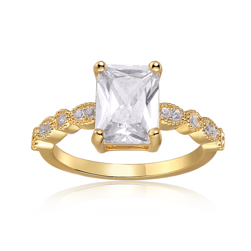 Features a 1.5-carat emerald center stone
Bezel set stones down the sides of the band
Set in a beautiful 4 prong setting

Sterling silver with gold plating
Available in sizes 4 through 11