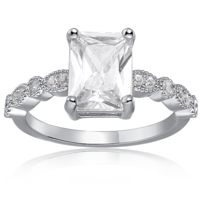 Features a 1.5-carat emerald center stone
Bezel set stones down the sides of the band
Set in a beautiful 4 prong setting

Sterling silver with Rhodium plating
Available in sizes 4 through 11