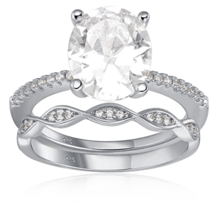 Features 2.5 carat oval center stone
The band is high-quality 925 sterling silver plated in rhodium or 14k gold with small stones inlaid halfway around.
Includes an eternity band that features a sleek and elegant design that will add a touch of sophistication to this set
Available in sizes 4 through 11