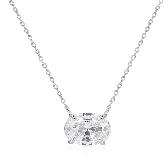 Our bestselling Dolly ring has a matching necklace! This dazzling 4-carat oval cut stone is 100% simulated diamond material (AAA CZ) and sparkles as much as a diamond.&nbsp;

Classic solitaire setting is made of certified 925 sterling silver
Plated in 14k gold and set in a 4-prong setting
Measures 18 inches long with a 2-inch linking chain
Also available in gold
