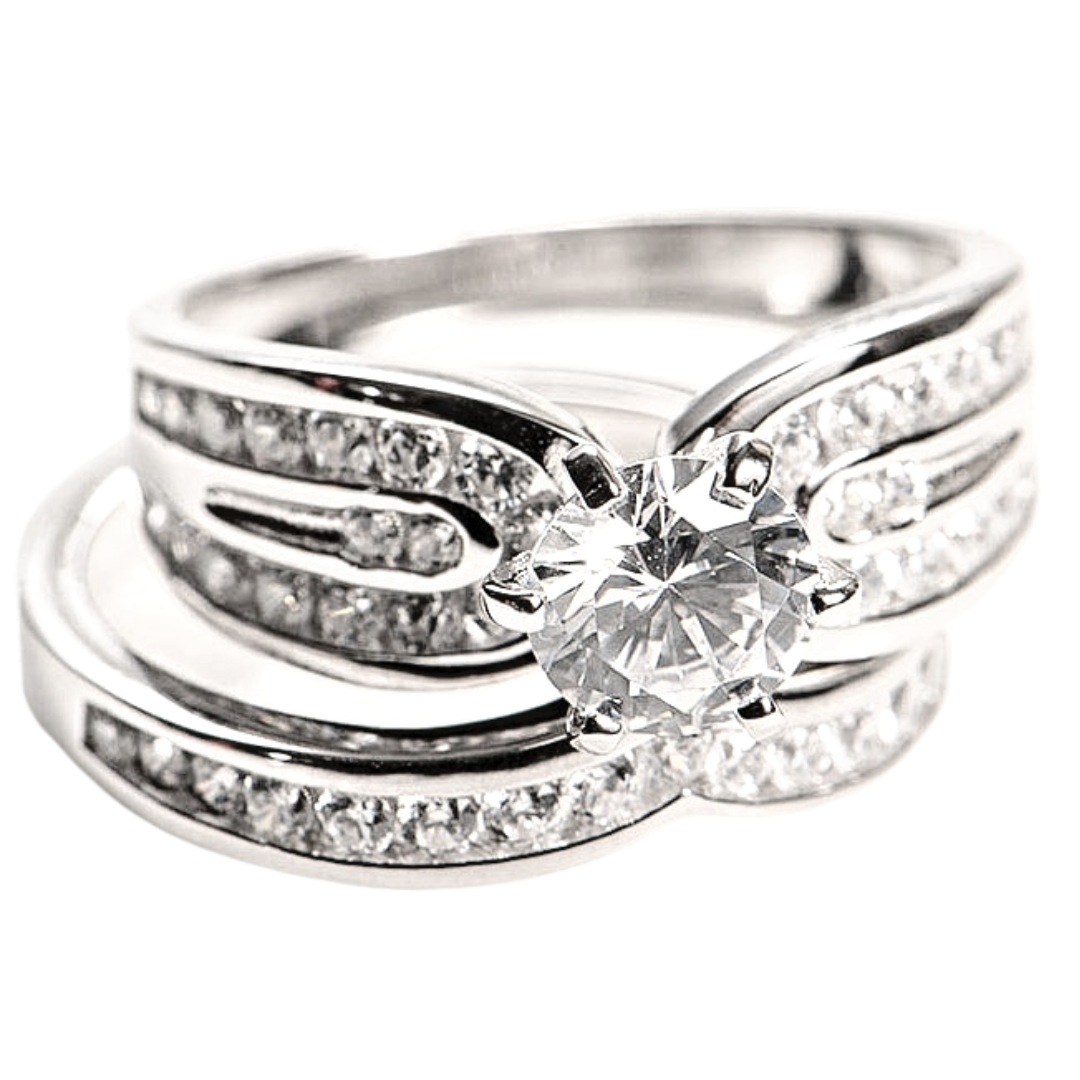 Features a 1.5-carat round cut center stone
Surrounded by a beautifully enhanced triple band design
Set in sterling silver with a prong and bezel setting
Plated in Rhodium

Available in sizes 4, 9, 11, 12, and 13